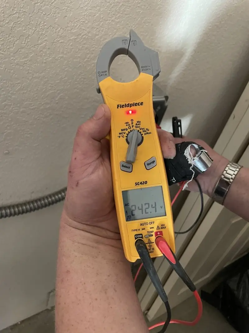 Voltage testing with clamp meter during Electrical Installation Services in Heron Bay